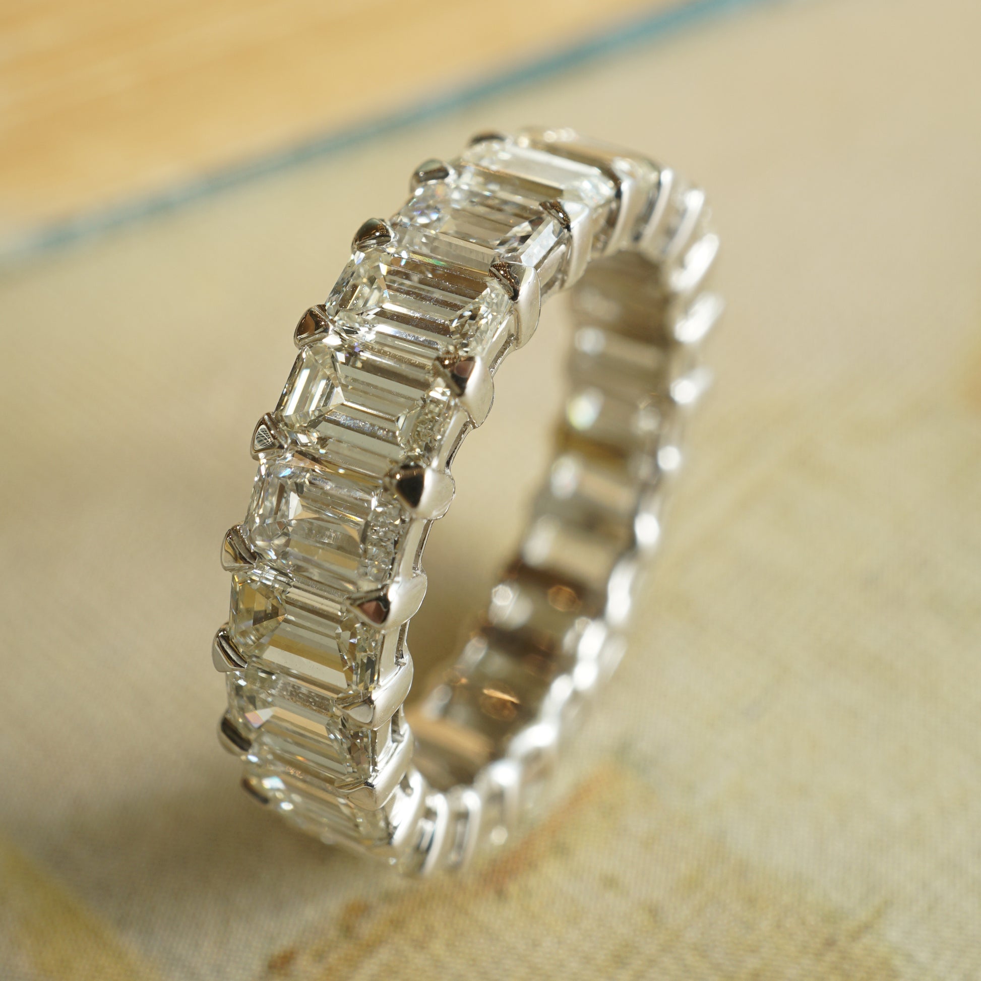 6.07 Baguette Cut Diamond Eternity Band in 18k White GoldComposition: 18 Karat White GoldRing Size: 6.5Total Diamond Weight: 6.07 ctTotal Gram Weight: 4.3 g
