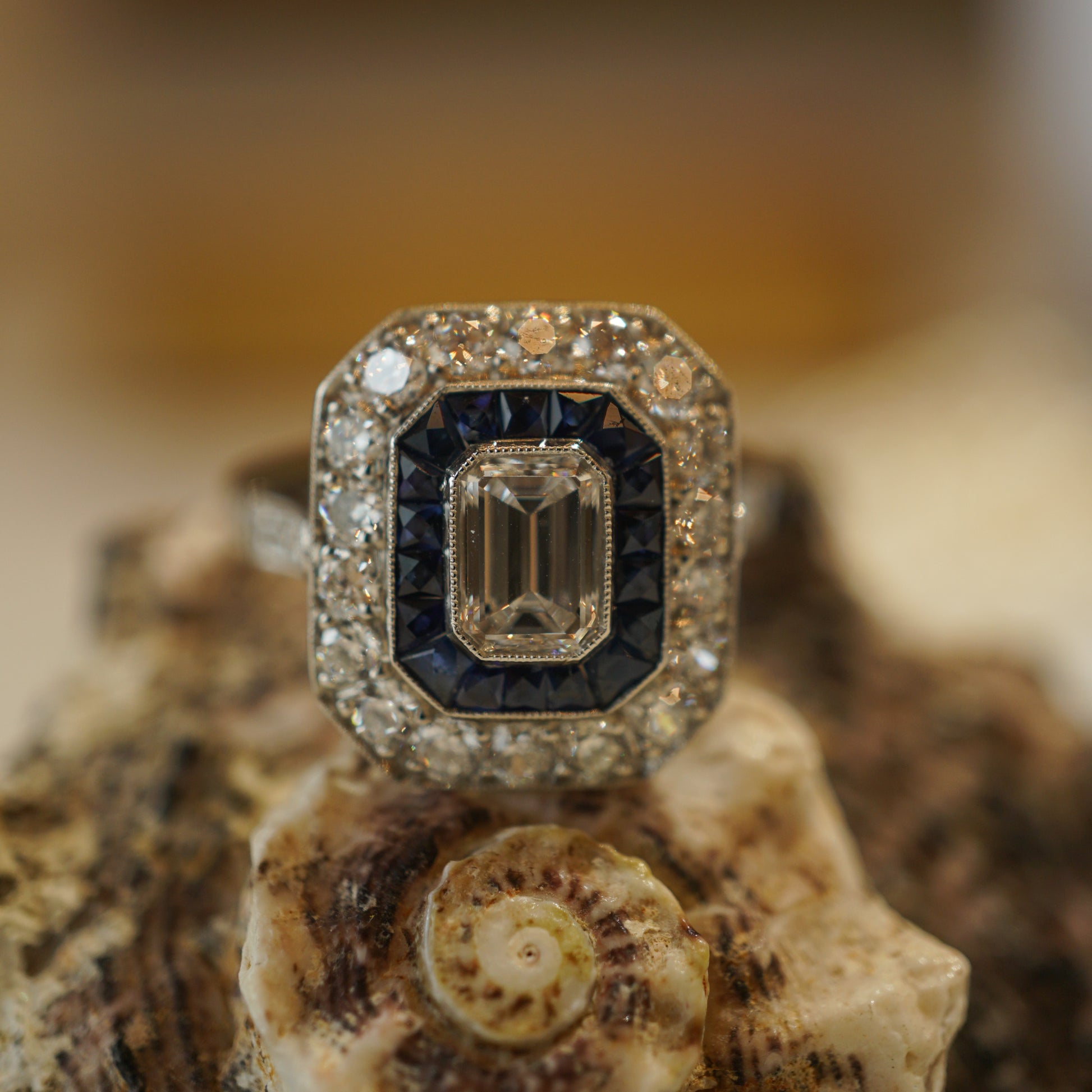 .58 Emerald Cut Diamond and Sapphire Engagement Ring in PlatinumComposition: PlatinumRing Size: 7Total Diamond Weight: 1.34 ctTotal Gram Weight: 4.6 g