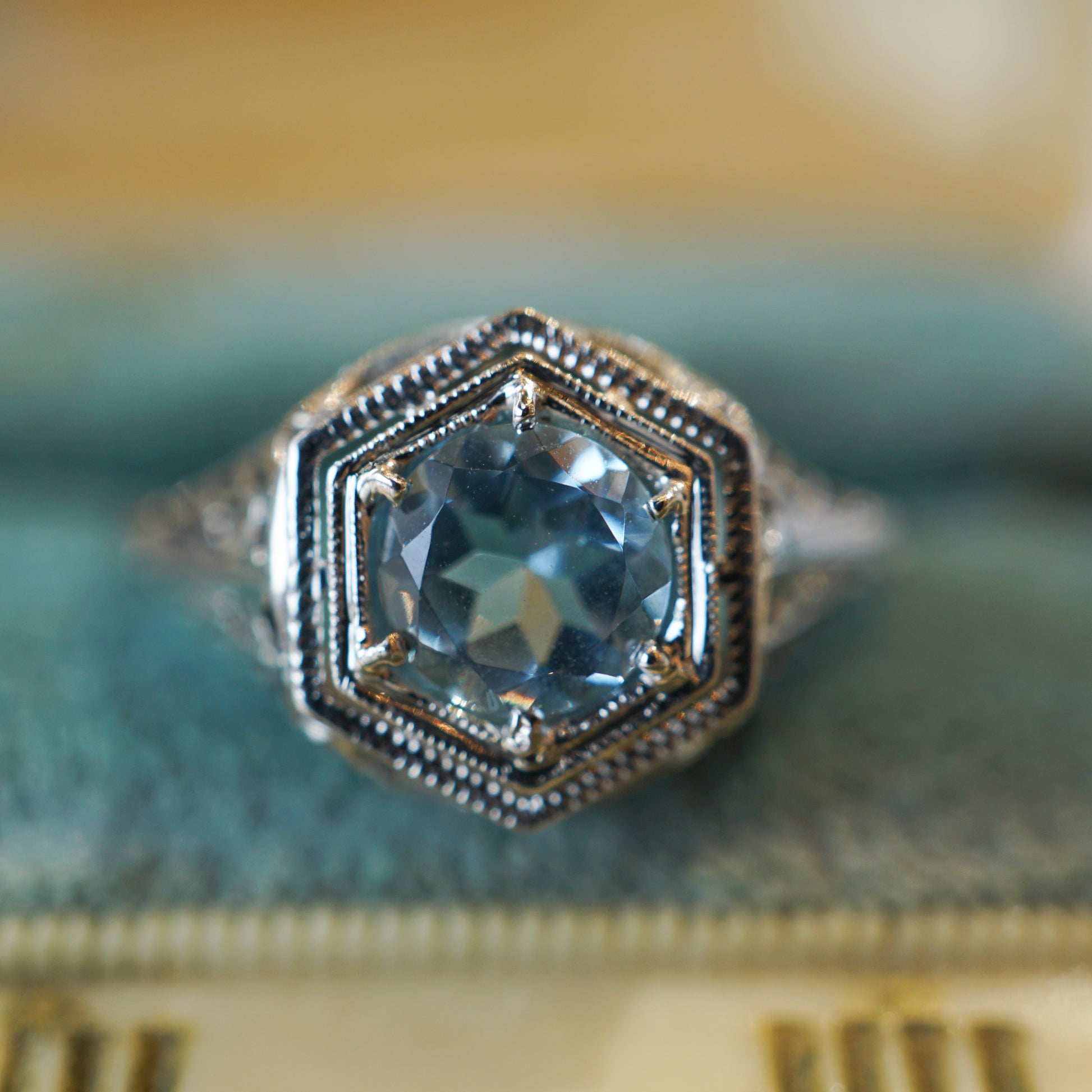 Art Deco Hexagonal Aquamarine Ring in 18K White GoldComposition: 18 Karat White GoldRing Size: 6.75Total Gram Weight: 2.2 gInscription: 18k