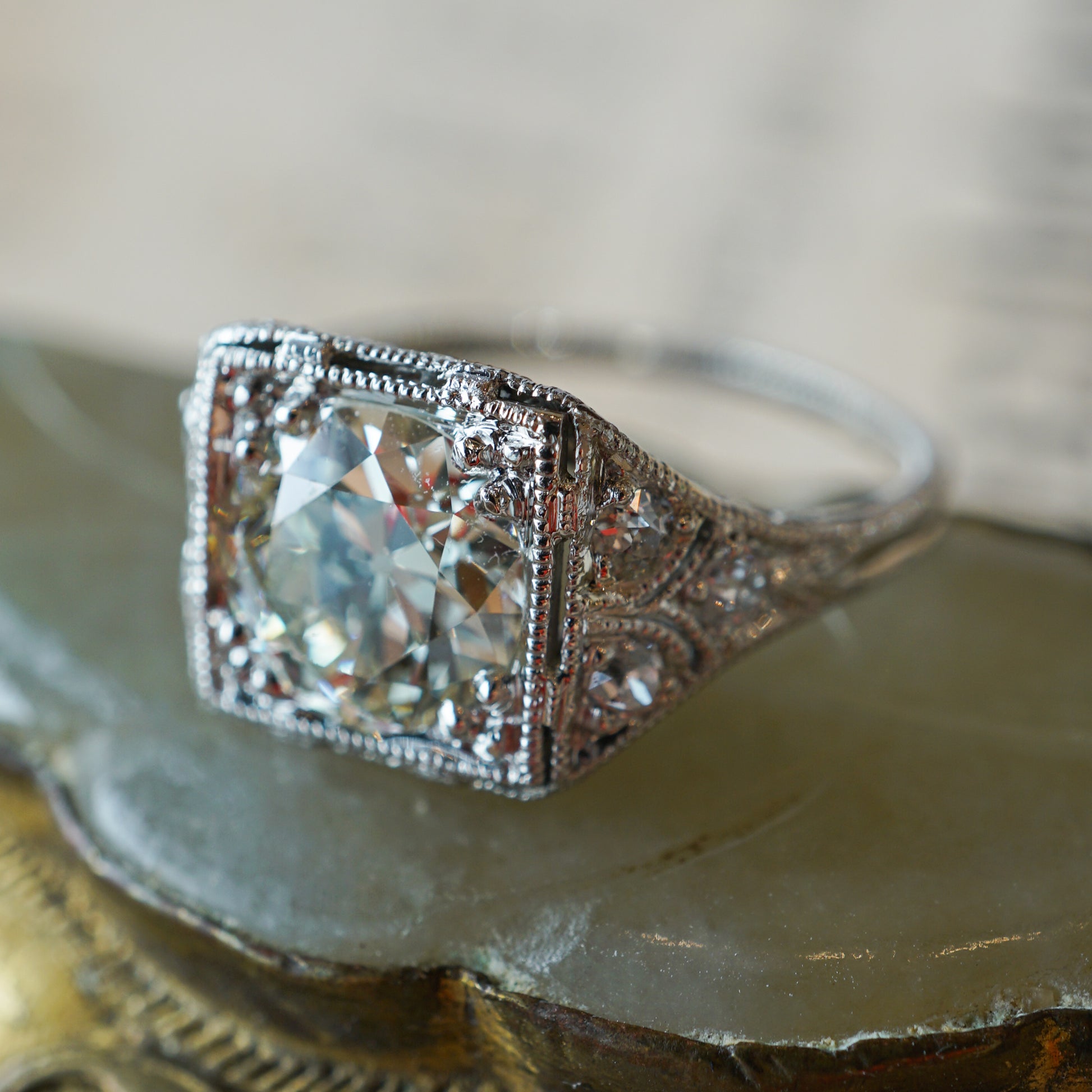 1.57 Antique Art Deco Diamond Engagement Ring in PlatinumComposition: PlatinumRing Size: 5.75Total Diamond Weight: 1.75 ctTotal Gram Weight: 3.5 g