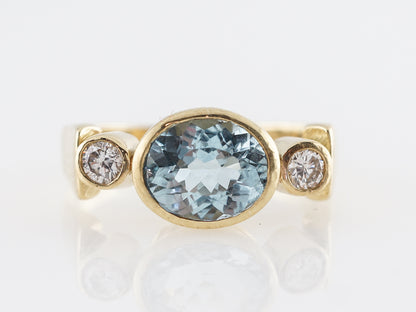 Oval Cut Aquamarine & Diamond Ring in 18k Yellow Gold