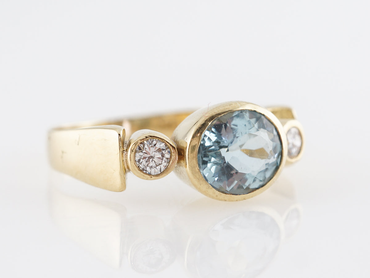 Oval Cut Aquamarine & Diamond Ring in 18k Yellow Gold