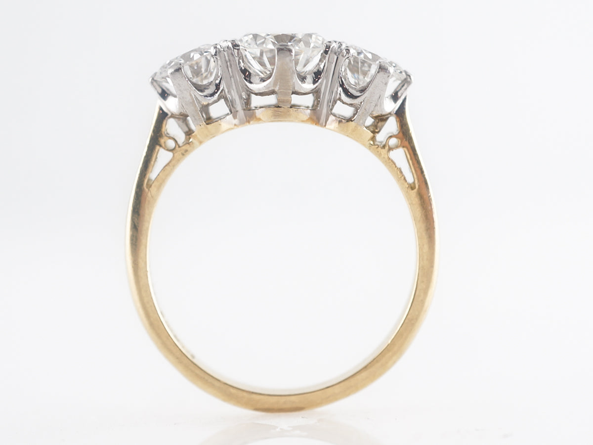 Retro Three Stone Engagement Ring in Platinum and Yellow Gold