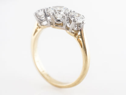 Retro Three Stone Engagement Ring in Platinum and Yellow Gold