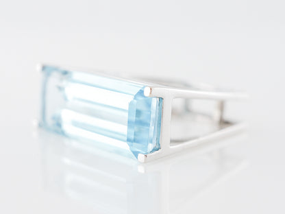 Emerald Cut Blue Topaz Cocktail Ring in 14k White Gold