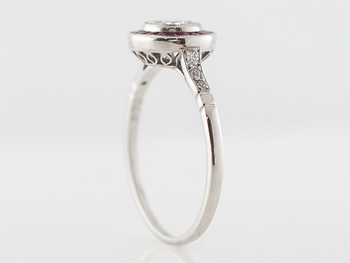 Ruby & Diamond Halo Engagement Ring in Platinum