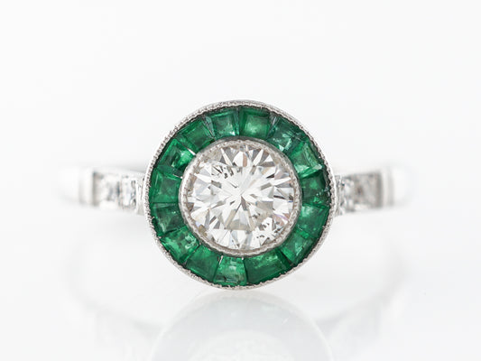 Diamond & Emerald Halo Engagement Ring in Platinum