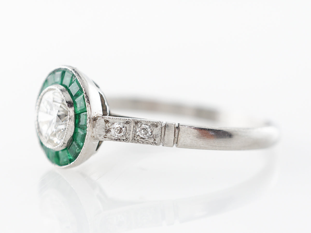 Diamond & Emerald Halo Engagement Ring in Platinum