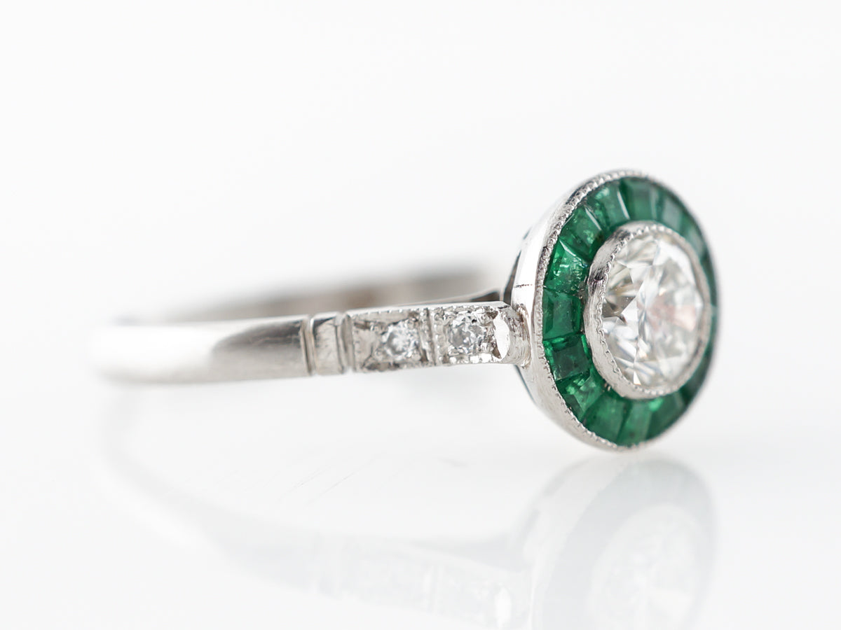 Diamond & Emerald Halo Engagement Ring in Platinum