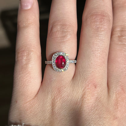 Oval Cut Red Sapphire & Diamond Halo Ring in Platinum