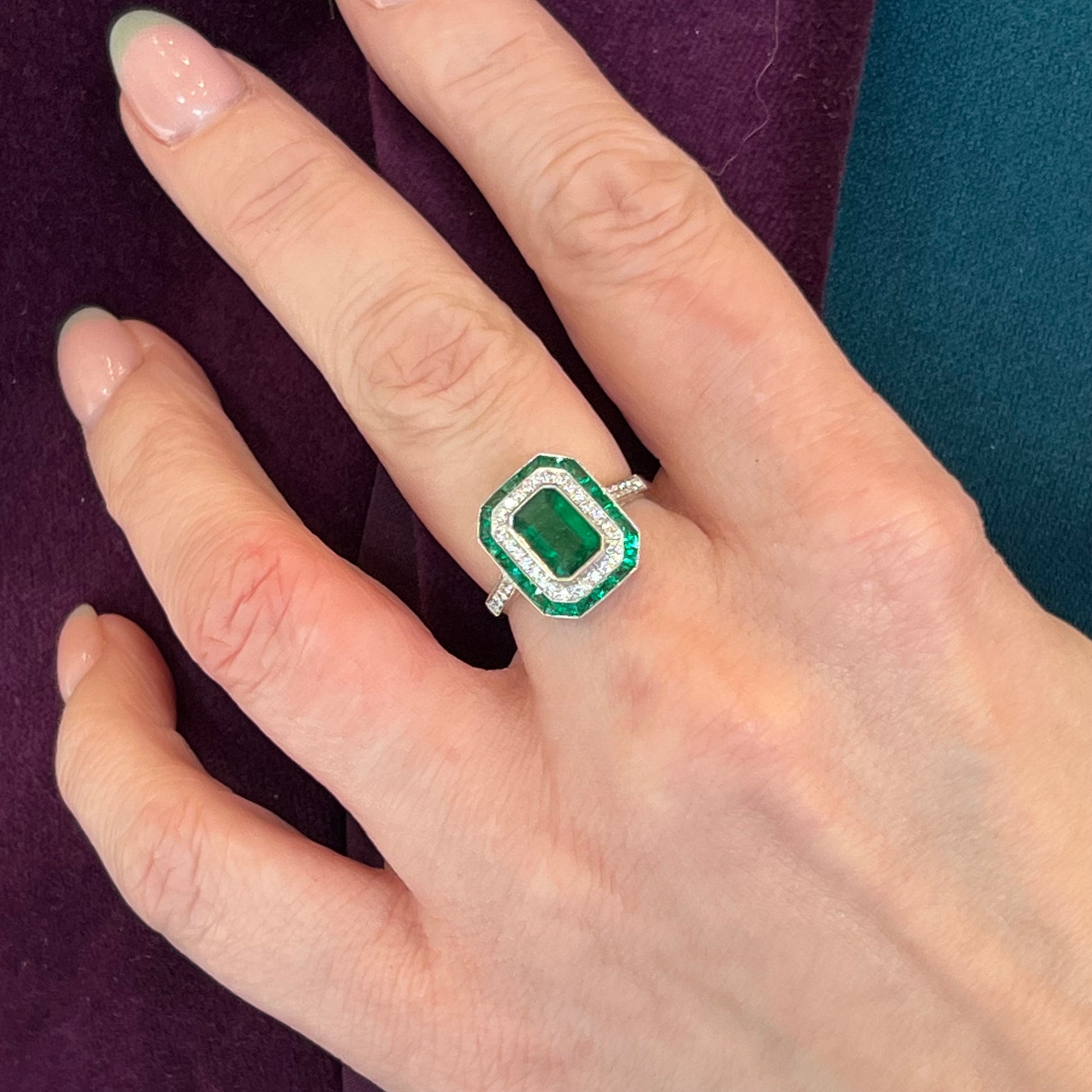 Bezel Set Emerald & Diamond Halo Cocktail Ring in Platinum