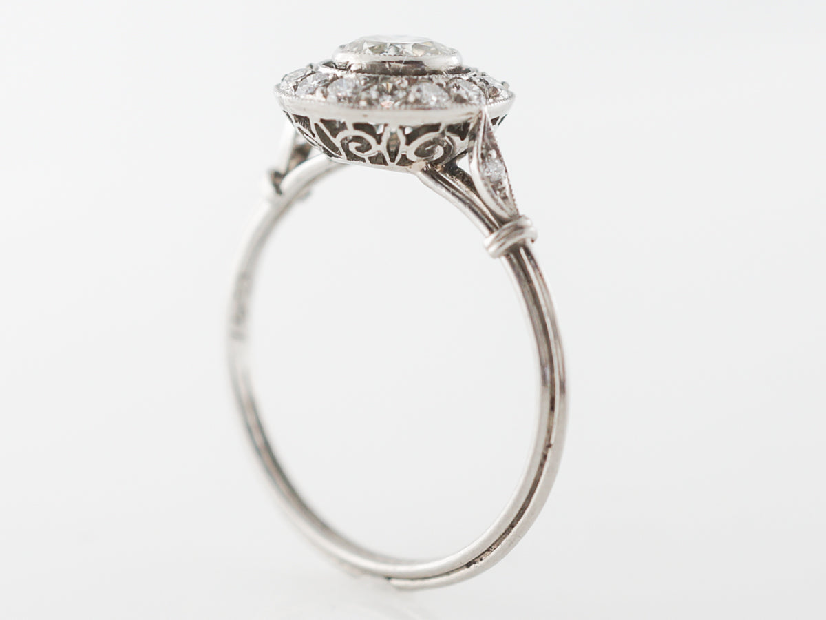 Bezel Set Diamond Halo Engagement Ring in Platinum
