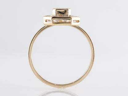 Halo Emerald Cut Diamond Engagement Ring in Yellow Gold