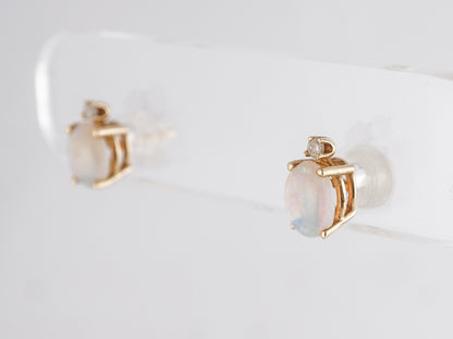 Cabochon Opal Stud Earrings in 14k Yellow Gold