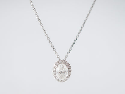 Oval Cut Diamond Halo Pendant in 18k White Gold