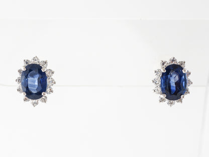 Oval Sapphire & Diamond Halo Earrings in Platinum