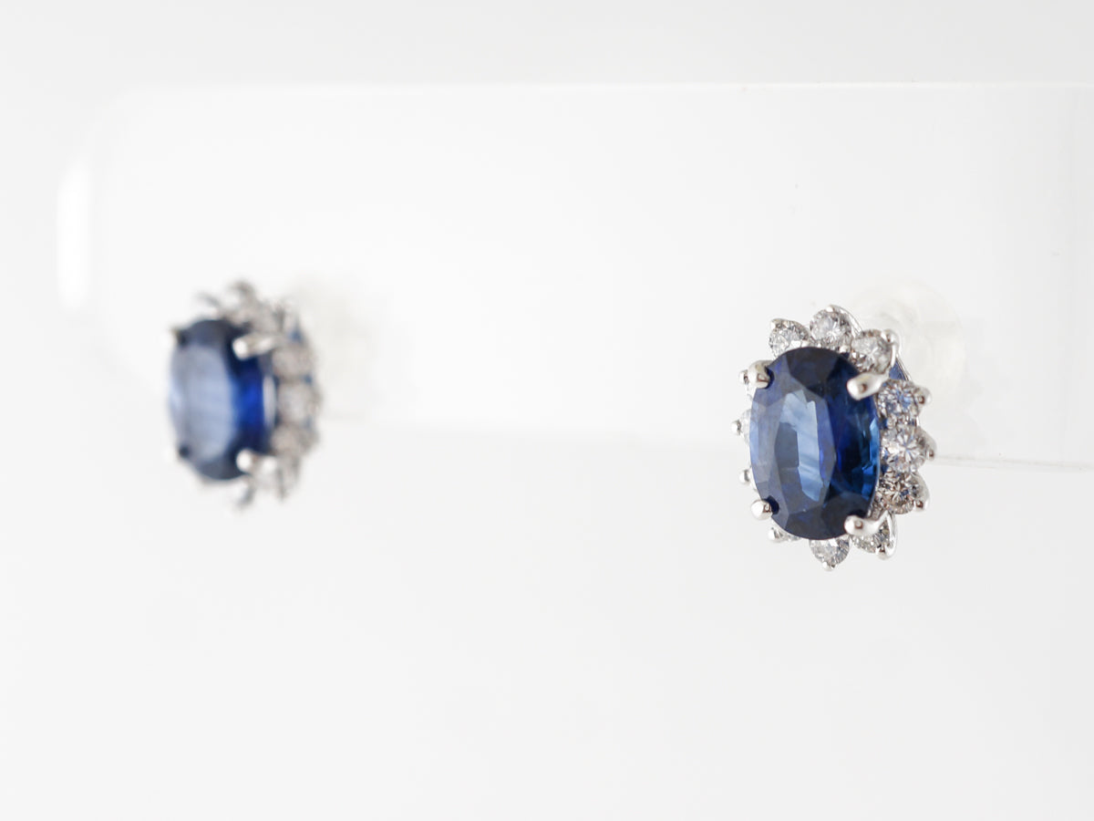 Oval Sapphire & Diamond Halo Earrings in Platinum