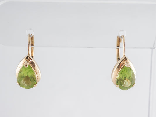 Pear Shaped Peridot Earrings in 14k Yellow Gold