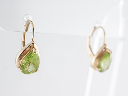 Pear Shaped Peridot Earrings in 14k Yellow Gold