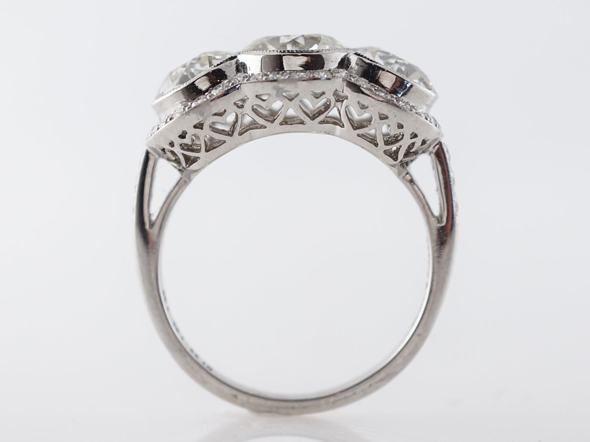 Three Stone Halo Engagement Ring in Platinum