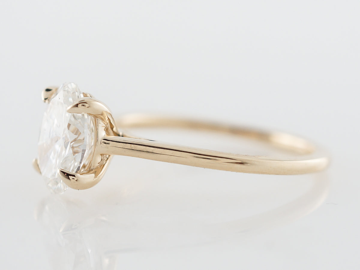 Oval Diamond Solitaire Engagement Ring in Yellow Gold