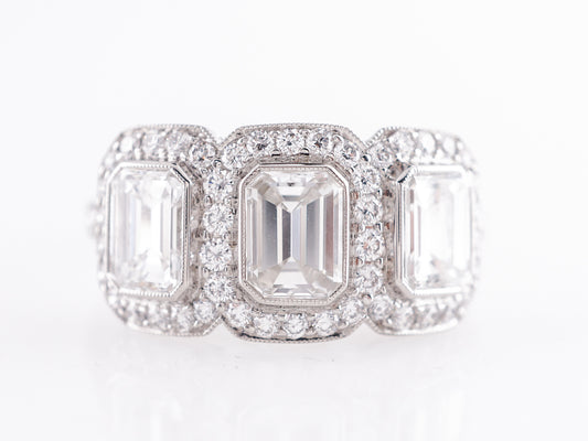 Deco Style Three Stone Emerald Cut Diamond Ring in Platinum