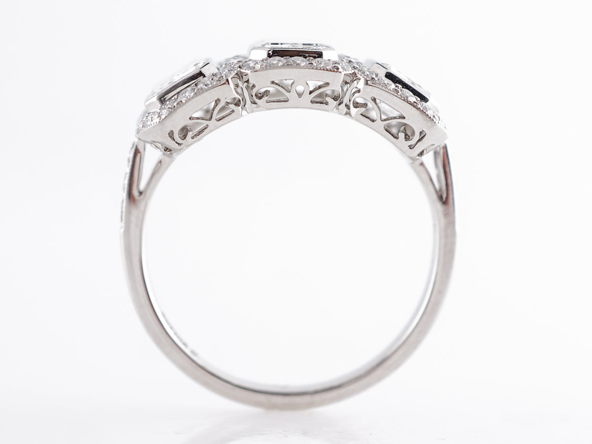 Deco Style Three Stone Emerald Cut Diamond Ring in Platinum