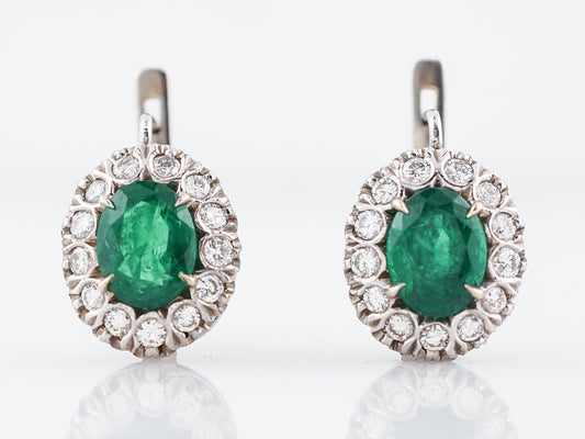 Vintage Earrings Mid-Century 3.30 Oval Cut Emeralds & .90 Round Brilliant Cut Diamonds in 18k White Gold