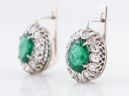 Vintage Earrings Mid-Century 3.30 Oval Cut Emeralds & .90 Round Brilliant Cut Diamonds in 18k White Gold
