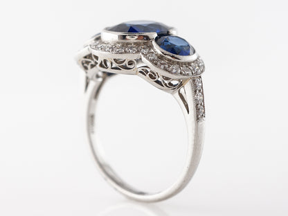 Three Stone Oval Sapphire & Diamond Ring in Platinum